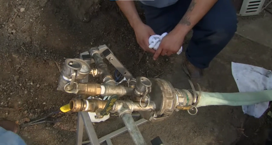 Inspecting a pipe with a machine – burst pipe repair in Montclair